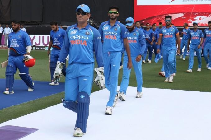 MS Dhoni leads Indian team out in their Super Four match against Afghanistan. MS Dhoni
