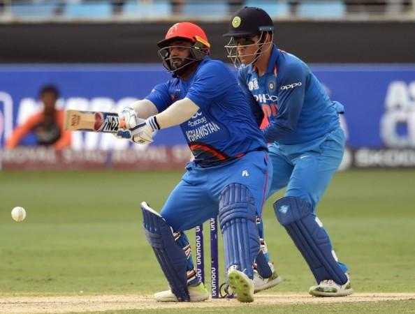Mohammad Shahzad went after Dhoni-led India's bowlers right from the first over. Mohammad Shahzad and MS Dhoni