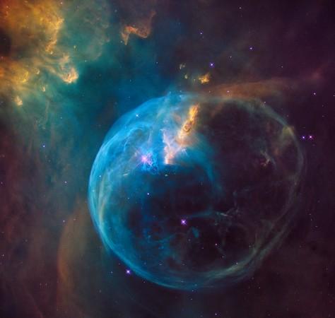A zoom into the Hubble Space Telescope photograph of an enormous, balloon-like bubble being blown into space by a super-hot, massive star. Astronomers trained the iconic telescope on this colorful feature, called the Bubble Nebula, or NGC 7635 Is there anybody out there?
