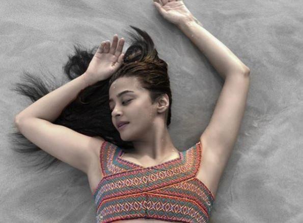 Surveen Chawla posing for the camera Surveen Chawla