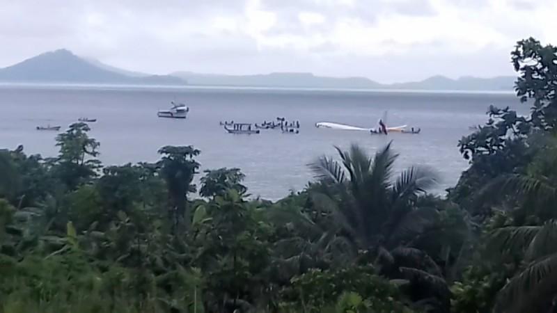 People are evacuated from an Air Niugini plane which crashed in the waters in Weno, Chuuk, Micronesia, September 28, 2018, in this still image taken from a video obtained from social media. Air Niugini plane