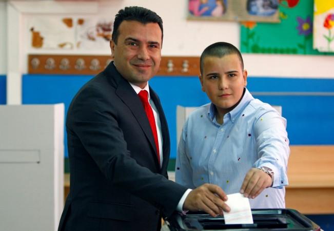 Macedonia's PM Zoran Zaev and his son Dushko cast their ballot for the referendum in Macedonia on changing the country's name that would open the way for it to join NATO and the European Union in Strumica, Macedonia September 30, 2018. i Macedonia