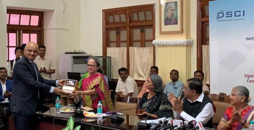 Praveen Sood IPS, Director General of Police, CID, Karnataka offering a memento to Ms Rama Vedashree, CEO, Data Security Council of India during MoU signing between Infosys Foundation in Vidhana Soudha on 3 October, 2018. Praveen Sood, Rama Vedashree, CEO, Data Security Council of India