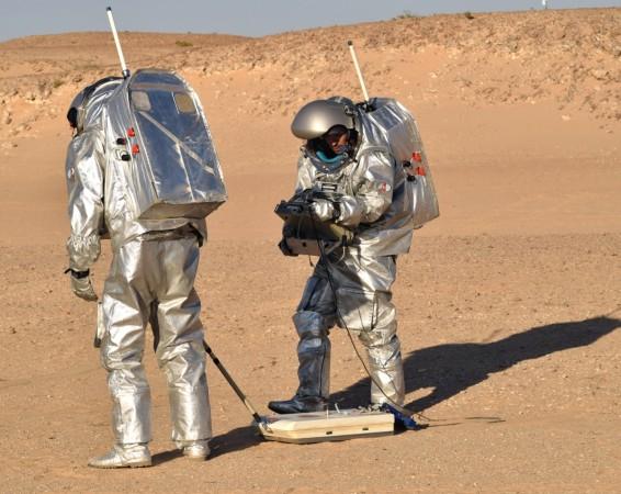 The analogue astronauts using the ScanMars radar in the Dhofar region, Oman during AMADEE-18 Mars scanner