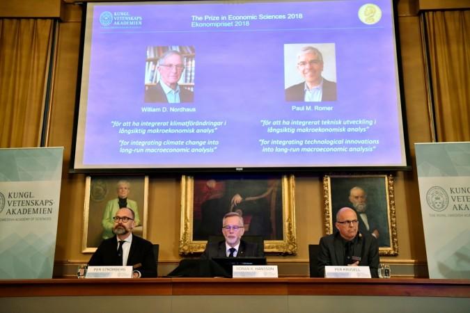 Per Stroemberg, Goeran K Hansson and Per Krusell announce the laureates of the Nobel Prize in Economics during a press conference at The Royal Swedish Academy of Sciences in Stockholm on October 8, 2018. - The Nobel Prize for Economic sciences 2018 was awarded US economists Paul M Romer and William D Nordhaus Nobel prize economics