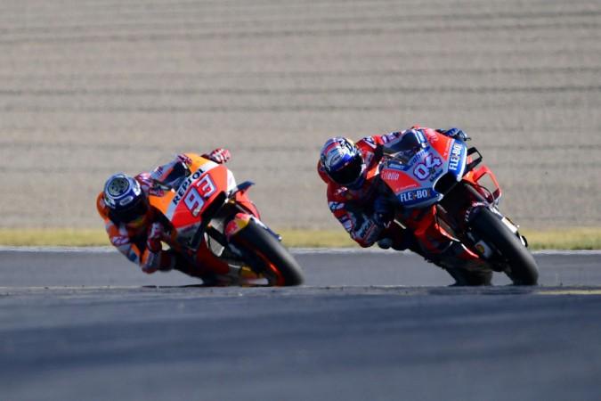 Marc Marquez (L) and Ducati Team Italian rider Andrea Dovizioso (R) compete during of the MotoGP Japanese Grand Prix at Twin Ring Motegi circuit in Motegi, Tochigi prefecture on October 21, 2018 MotoGP of Japan