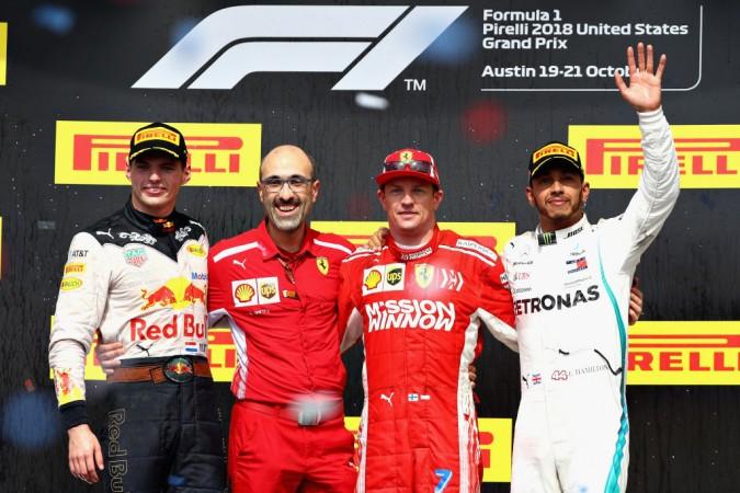 Winner Kimi Raikkonen of Ferrari, second-placed Max Verstappen of Red Bull Racing and third placed Lewis Hamilton of Mercedes GP celebrate on the podium US grand prix, Formula 1