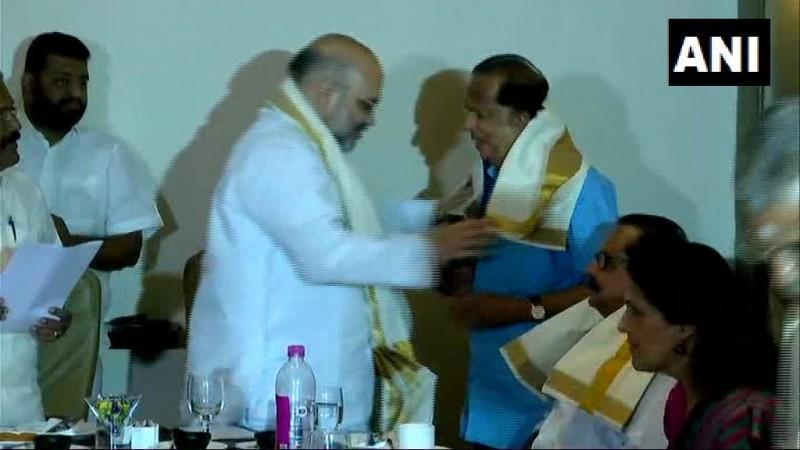 BJP President Amit Shah felicitating Former ISRO chief Madhavan Nair on Saturday madhavan nair amit shah