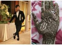 Karan Tacker (left) Fan with his name on her hand (right)
