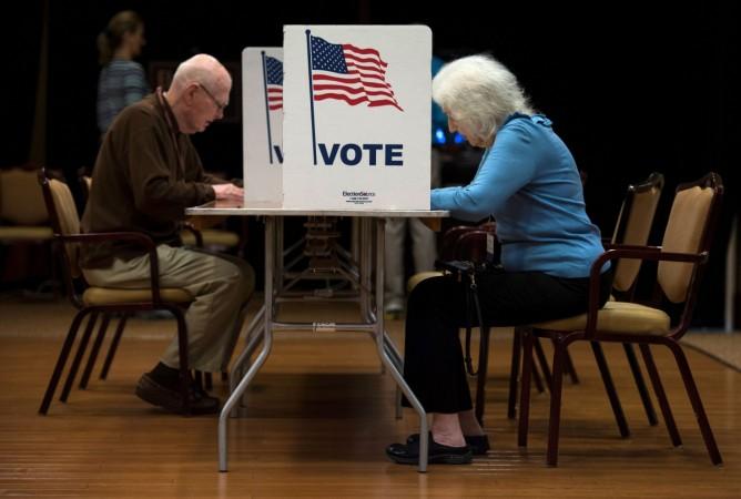 People vote at the Greenspring Retirement center during the mid-term election day in Fairfax, Virginia on November 6, 2018. US Mid-term elections