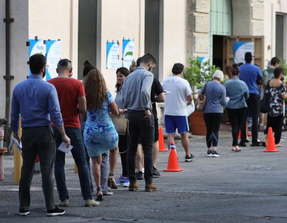 Voters line up to cast their ballot just before the polls open in the mid-term election on November 06, 2018 in Miami, United States. US Mid-term elections