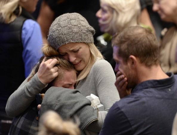 Mourners cry and comfort each other during a vigil for the victims of the mass shooting at the Thousand Oaks Civic Arts Plaza on November 8 Thousand Oaks shooting
