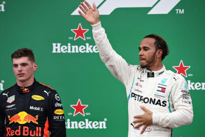 Race winner Lewis Hamilton celebrates on the podium with second placed Max Verstappen Lewis Hamilton, Brazil GP