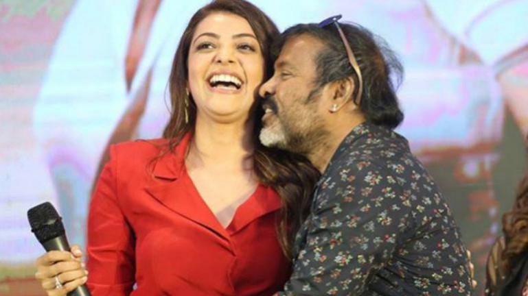 Chota K Naidu kissing Kajal Aggarwal at Kavacham press meet Chota K Naidu kissing Kajal Aggarwal at Kavacham press meet