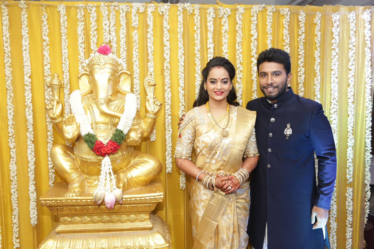 Suja Varunee and Shiva Kumar posing for the camera at their wedding reception. Suja Varunee-Shiva Kumar Wedding Reception Photos