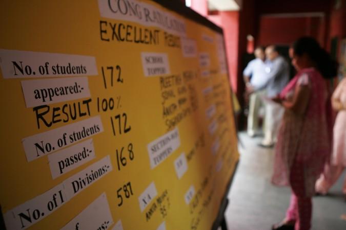 Results of Class Ten students of the Central Board of Secondary Education examinations in India are displayed on a St Thomas School notice board in New Delhi, 29 May 2007. Exam, marks card, sslc