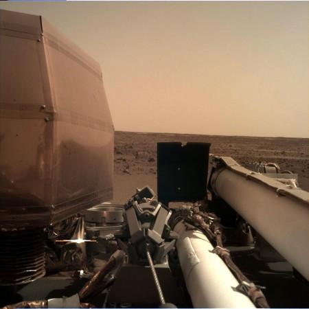 The Instrument Deployment Camera (IDC), located on the robotic arm of NASA's InSight lander, took this picture of the Martian surface on Nov. 26, 2018, the same day the spacecraft touched down on the Red Planet. InSight