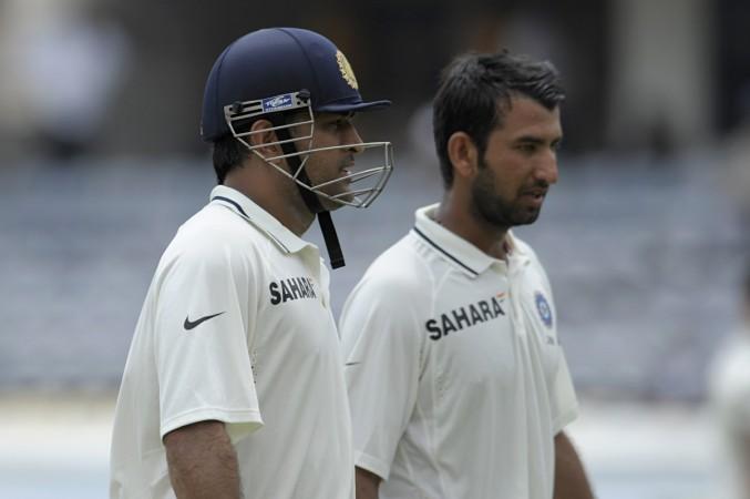 Pujara (R) with former captain Dhoni (L) Pujara Dhoni