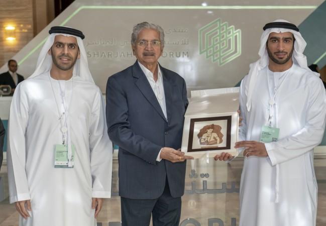 Subash Desai handing over momento. Subash Desai