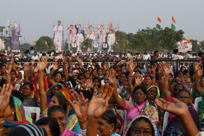 Supporters of Indian Congress party gesture during a public meeting for the campaign of the 2018 Telangana state Assembly elections at Medchal constituency some 30 kms from Hyderabad, on November 23, 2018. - The Telangana Legislative Assembly election is scheduled to be held in Telangana state on 7 December 2018 to constitute the second Legislative Assembly Telangana assembly elections