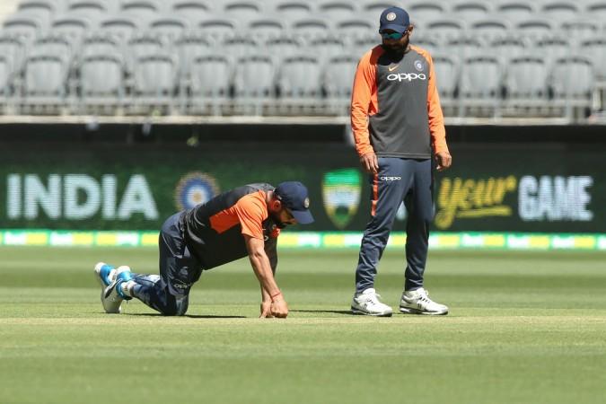 Kohli (L) and Shami (R) inspect the pitch at Perth Virat Kohli Mohammed Shami India cricket team