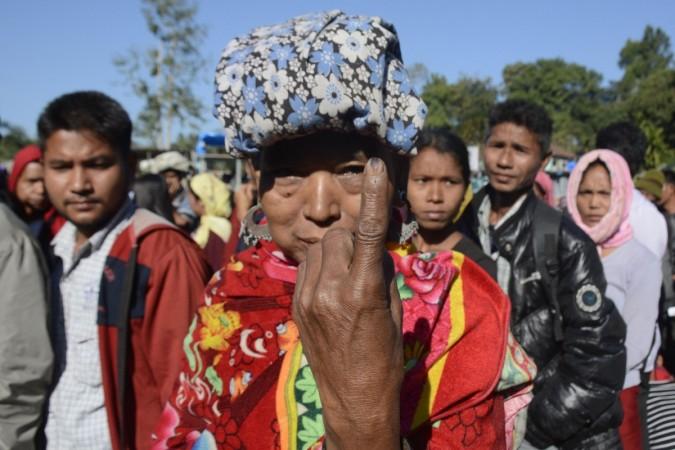 A voter displays her finger marked with indelible ink after casting her vote at a polling station during the Mizoram state assembly election at Kanhmun in Mamit district, some 192 kms from Aizawl, the capital of India's northeastern state of Mizoram, on November 28, 2018. (Photo by Arindam DEY / AFP) INDIA-POLITICS-ELECTION-VOTE