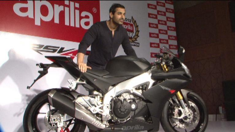 John Abraham with Aprilia RSV4 John Abraham with Aprilia RSV4