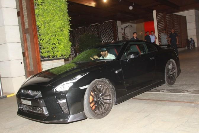 John Abraham driving his Nissan GT-R Black edition John Abraham with Nissan GT-R