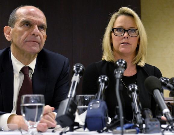 Former Boston news anchor Heather Unruh (R) sits with her attorney Mitchell Garabedian at a press conference in Boston November 8, 2017 during which she accused actor Kevin Spacey of allegedly sexually abusing her son in July 2016 at the Club Carr restaurant on Nantucket Island. Projects are shelved, film releases cancelled, sets shuttered, studios threatened, the Oscars rattled -- this is the chaos confronting Hollywood following sex scandals that have brought down power players like Harvey Weinstein, Kevin Spacey and Brett Ratner. / AFP PHOTO / Joseph PREZIOSO US-ENTERTAINMENT-FILM-ASSAULT