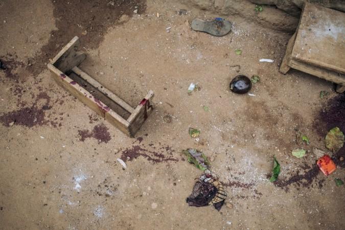 Traces of blood and broken objects are strewn all over the place where civilians were killed in an attack in Masiani district in Beni last night by armed men on December 23, 2018. - At least five people, including four civilians, were killed in an attack by suspected Ugandan rebels in DR Congo, an AFP correspondent and witnesses said on on December 23, 2018. The attack targeted the locality of Masiani in the Beni region of eastern Democratic Republic of Congo overnight. (Photo by ALEXIS HUGUET / AFP) DRCONGO-UGANDA-CONFLICT-UNREST