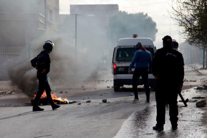 Tunisian policemen stand in a street during a demonstration on December 25, 2018 in the west-central Tunisian city of Kasserine Tunisia unrest