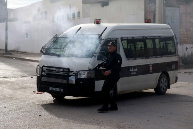 Tunisian policemen fire teargas towards protesters during a demonstration on December 25, 2018 in the west-central Tunisian city of Kasserine. Tunisia unrest