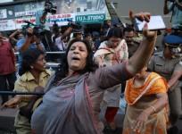 India police intervene as members of Sabarimala Karma Samithi try to disrupt a celebratory meeting after two women entered Sabarimala Ayyapa temple