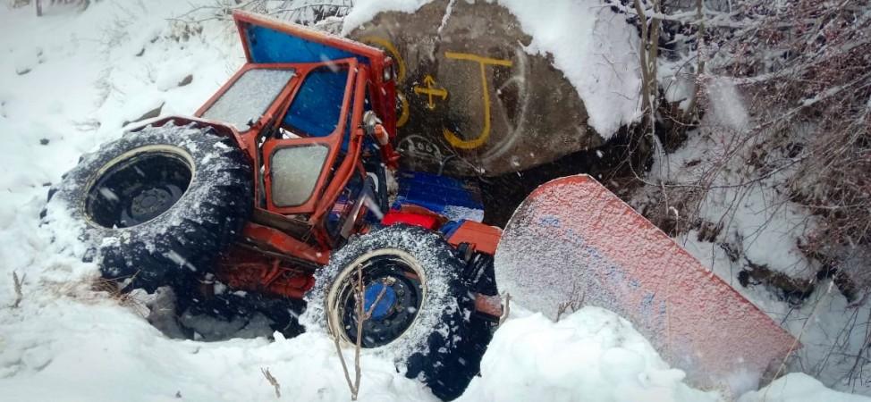 A snow clearance machine that got stuck risking its driver, Mehrajuddin Ganaie in Kashmir snow clearance