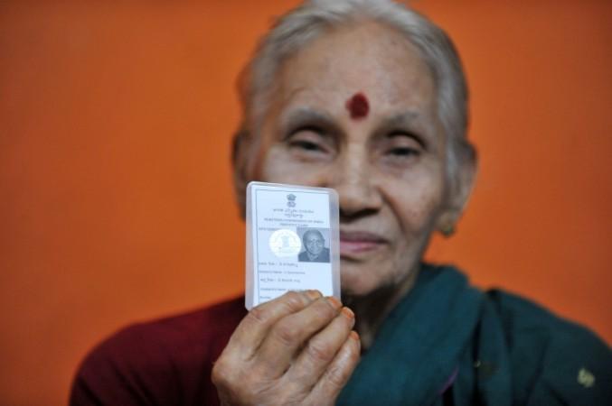 Indian Vangipurapu Savithramma, 82, poses with her Voter's Identity card as she votes since 1952, in Hyderabad on January 25, 2012. The 25th January observed as the' National Voters Day' through the country with the theme of 'Proud to be a Voter-Ready to Vote'. AFP PHOTO / Noah SEELAM Indian Vangipurapu Savithramma, 82, pose