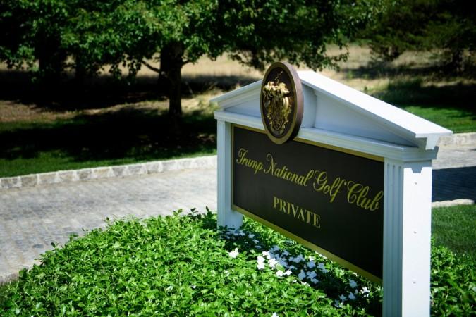 A sign is seen at an entrance to the Trump National Golf Club Trump National Golf Club
