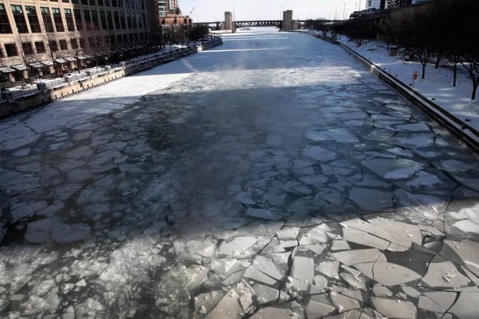 Ice covers the Chicago River as US experiences chilling weather polar vortex