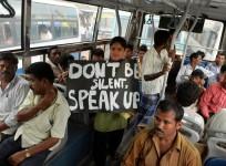 An Indian protester belonging to the Bangalore Bus Passengers Forum holds a placard, against the sexual harassment of women passengers