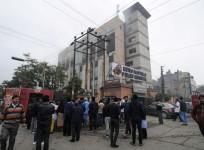 Onlookers gather outside Metro Hospital after a fire in the facility in Noida near the Indian capital New Delhi on February 7, 2019
