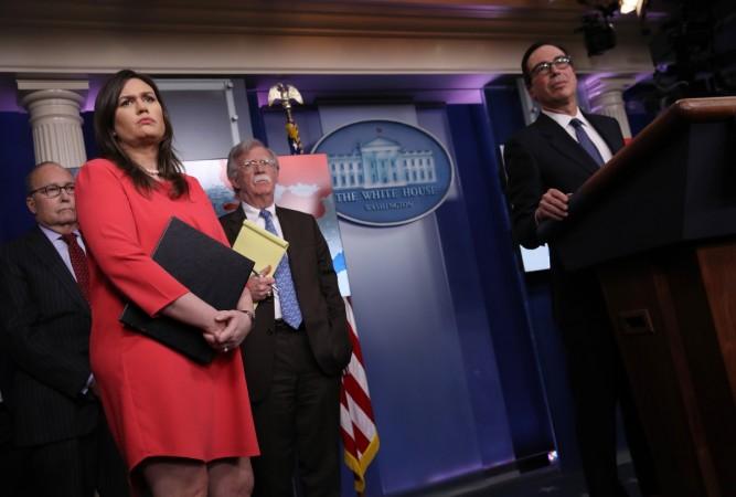 Director of the National Economic Council Larry Kudlow, White House press secretary Sarah Sanders, National Security Advisor John Bolton and Treasury Secretary Steve Mnuchin listen to questions from reporters during a press briefing at the White House January 28, 2019 in Washington, DC. During the briefing, economic sanctions against Venezuela's state owned oil company were announced in an effort to force Venezuelan President Maduro to step down. Sarah Sanders