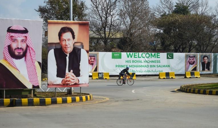 Portraits of Saudi Arabian Crown Prince Mohammed bin Salman (L) and Pakistan's Prime Minister Imran Khan (R) and a banner welcoming the prince ahead of his arrival in Islamabad on February 15, 2019 Prince Salman pakistan visit