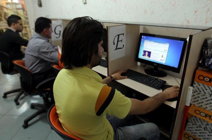 TO GO WITH AFP STORY BY MOHAMMAD DAVARI - Iranians use internet at a cybercafe in the center of the Iranian capital Tehran on May 14, 2013. Iran is tightening control of the Internet ahead of next month's presidential election, mindful of violent street protests that social networkers inspired last time around over claims of fraud, users and experts say. IRAN-VOTE-INTERNET-CENSOR