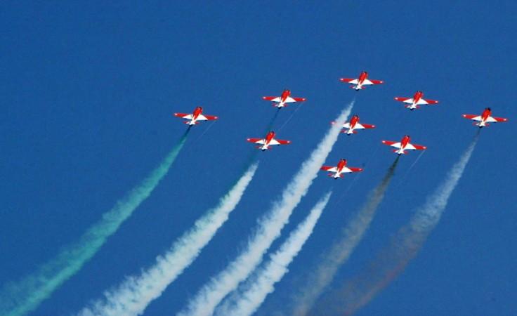The Indian Air Force Surya Kiran aerobatics demonstration team fly their HJT-16 Kiran aircraft in formation during the opening day of India Aviation 2008 at Begumpet Airport in Hyderabad on October 15, 2008. The Indian Air Force Surya Kiran aerobat