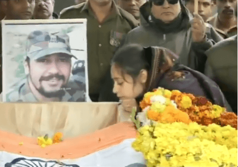 Army Major Vibhuti Shankar Dhoundiyal's coffin was kept draped in the Tricolour. His wife Nikita Kaul, stood next to it. Army Major Vibhuti Shankar Dhoundiyal