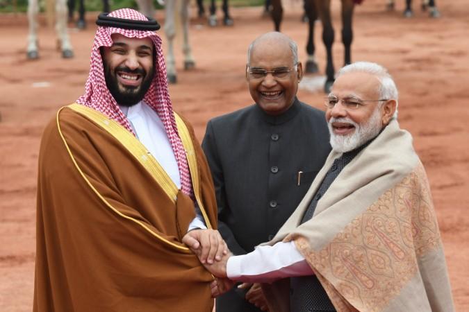India's President Ram Nath Kovind (C) looks on as Saudi Crown Prince Mohammed bin Salman (L) and India's Prime Minister Narendra Modi shake hands during a ceremonial reception at the presidential palace in New Delhi on February 20, 2019. INDIA-SAUDI-DIPLOMACY
