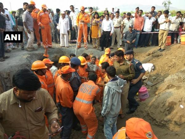 Rescuers manage to bring out the boy from a borewell. pUNE BOY BOREWELL