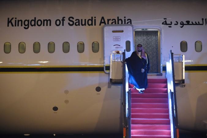 Saudi Crown Prince Mohammed Bin Salman looks on as he deplanes upon arriving at the airport in New Delhi on February 19, 2019 Prince Salman in India