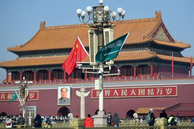 The national flags of Saudi Arabia (R) and China are displayed from a road lamp at Tiananmen square in Beijing on February 21, 2019. - Saudi Crown Prince Mohammed bin Salman is on a visit to China from February 21 to 22. (Photo by WANG Zhao / AFP) Saudi Crown Prince Mohammed bin Salman visits China