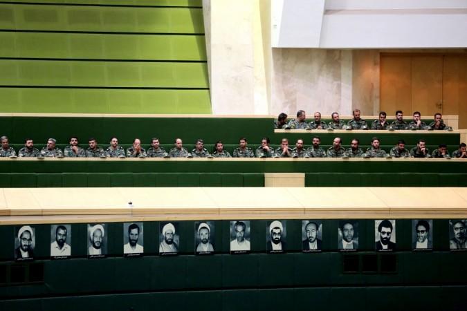 Members of the Iranian Revolutionary Guard listen to a speech in parliament in Tehran on October 7, 2018, over the a bill to counter terrorist financing. - The bill, one of four put forward by the government to meet demands set by the international Financial Action Task Force (FATF), was passed by 143 votes to 120, according to the semi-official ISNA news agency. Iran at FATF