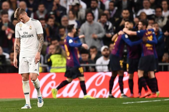 Toni Kroos stands disappointed as Barcelona scores their second goal in the Copa Del Rey semifinal second leg. Barcelona vs Real Madrid Lionel Messi Toni Kroos